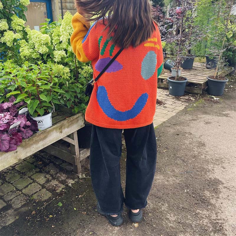 Lässiger Strickpulli mit Smiley-Motiv