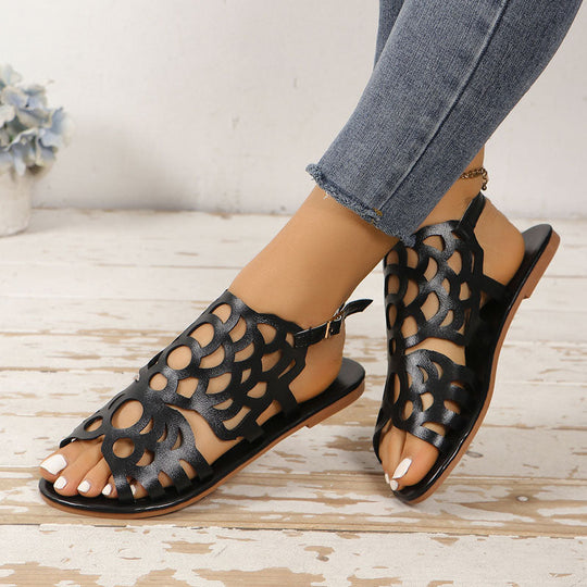 Sandalen mit flachen, geschnitzten Ethno-Designs